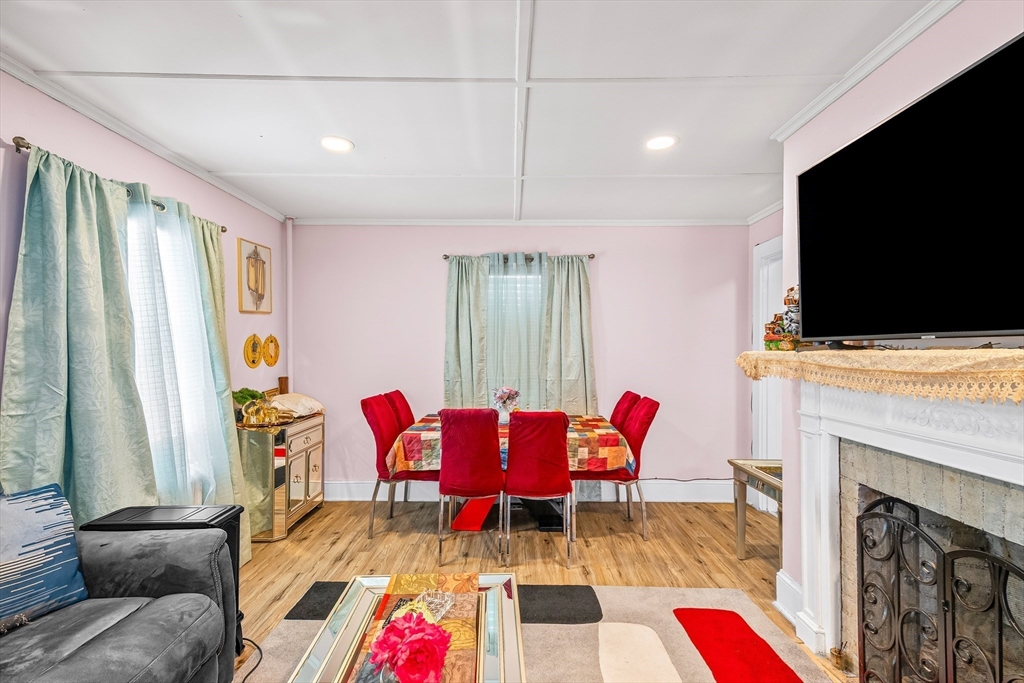 28 Maple Street Southbridge, MA 01550 - Photo 8 of 25 a living room with furniture fireplace and flat screen tv