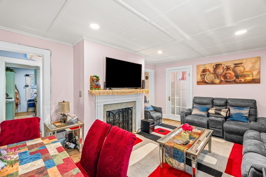 28 Maple Street Southbridge, MA 01550 - Photo 9 of 25 a living room with furniture and a flat screen tv
