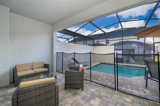 a view of a backyard with a patio and a patio