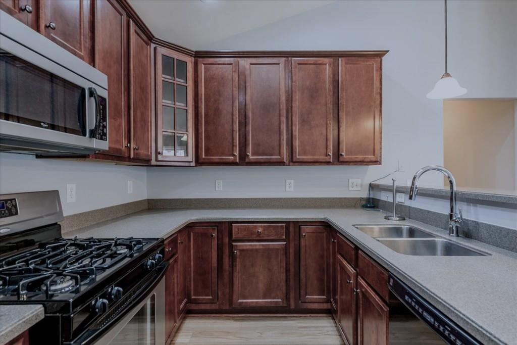 150 Jaime Drive Canton, GA 30114 - Photo 13 of 34 a kitchen with stainless steel appliances granite countertop a sink stove and cabinets
