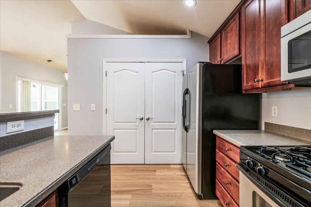 150 Jaime Drive Canton, GA 30114 - Photo 15 of 34 a kitchen with stainless steel appliances granite countertop a refrigerator stove and sink