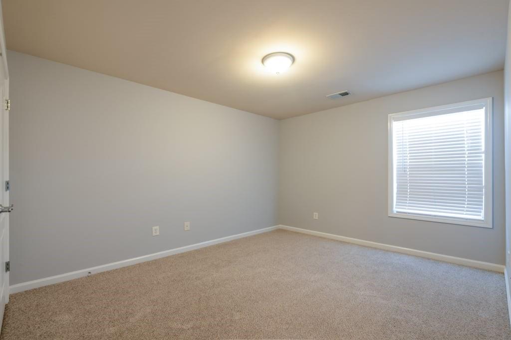 150 Jaime Drive Canton, GA 30114 - Photo 17 of 34 an empty room with a window
