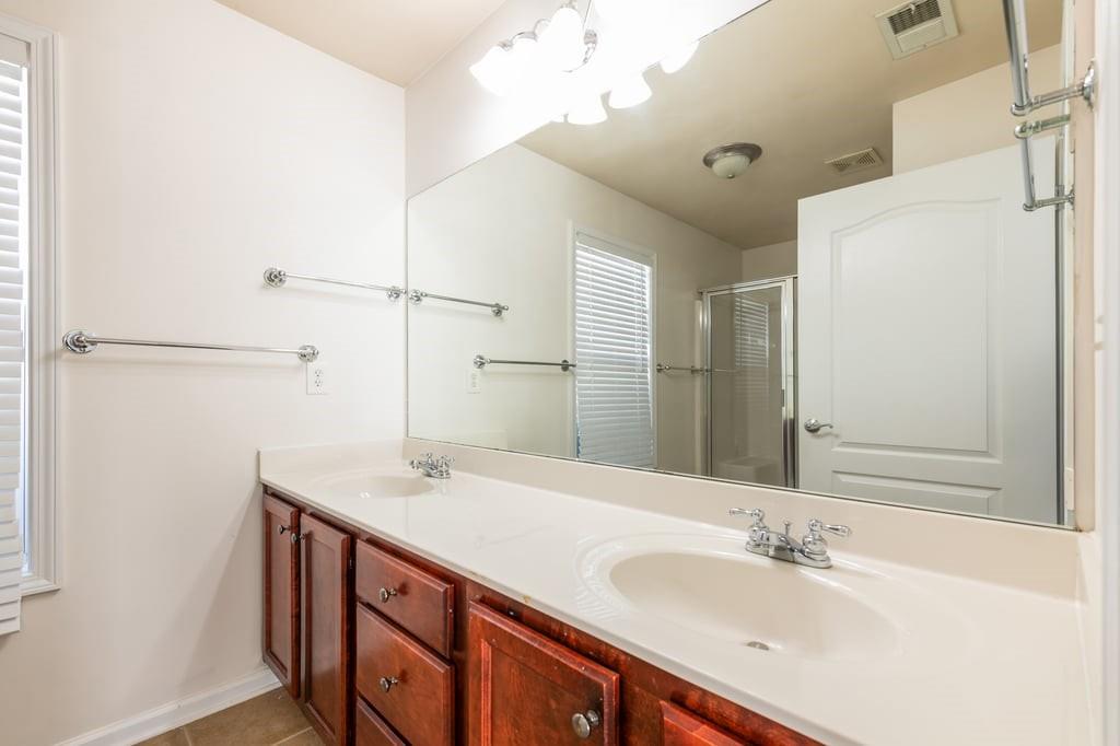 150 Jaime Drive Canton, GA 30114 - Photo 20 of 34 a bathroom with a sink and a mirror