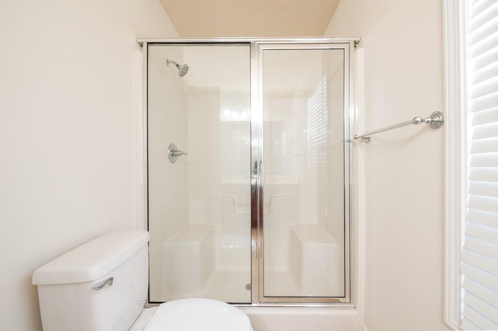 150 Jaime Drive Canton, GA 30114 - Photo 21 of 34 a bathroom with a shower and a toilet