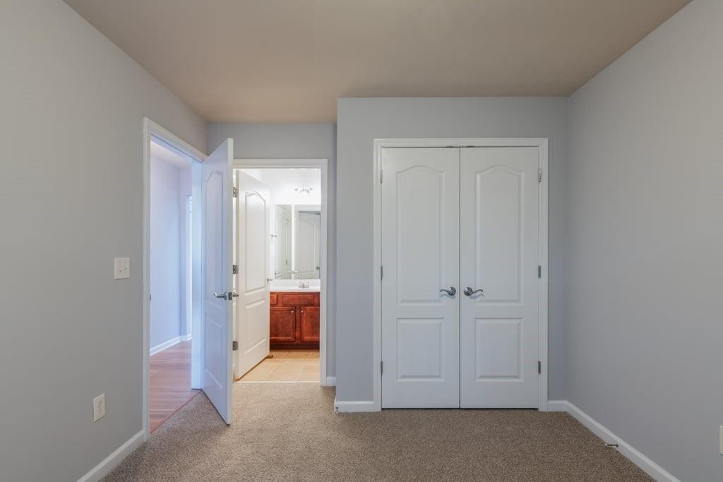 150 Jaime Drive Canton, GA 30114 - Photo 22 of 34 wooden floor and closet in white room