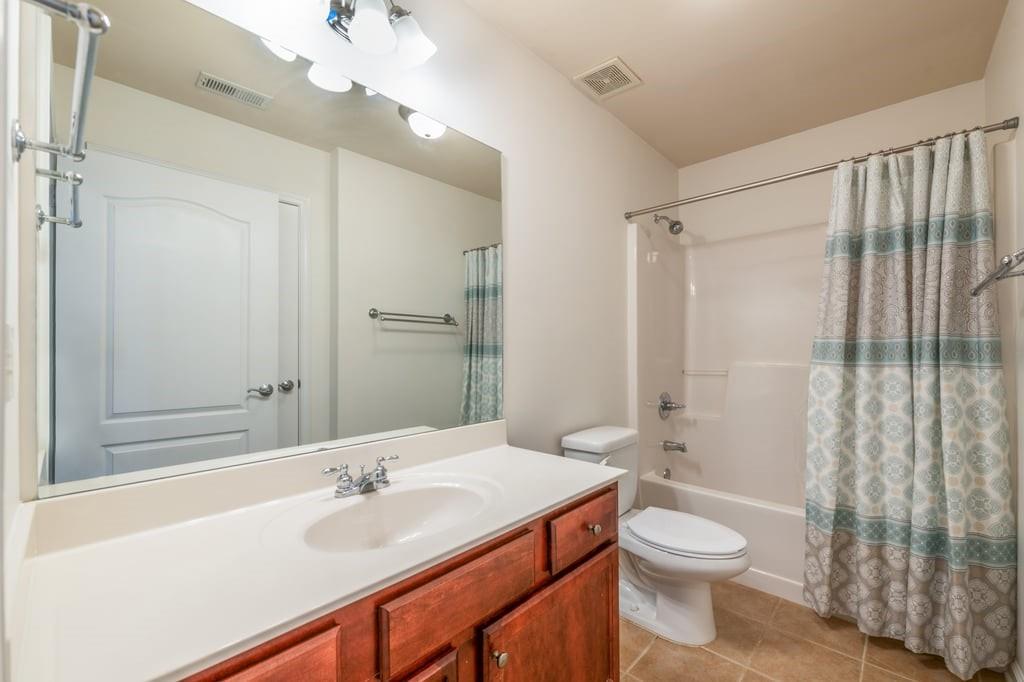 150 Jaime Drive Canton, GA 30114 - Photo 23 of 34 a bathroom with a sink a toilet and shower