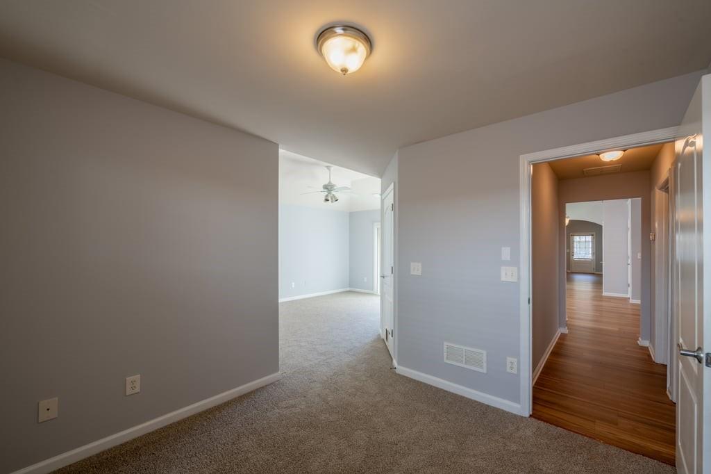 150 Jaime Drive Canton, GA 30114 - Photo 24 of 34 an empty room with wooden floor and windows