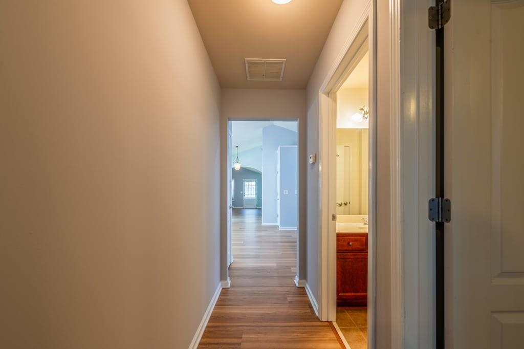 150 Jaime Drive Canton, GA 30114 - Photo 25 of 34 a view of a hallway with wooden floor
