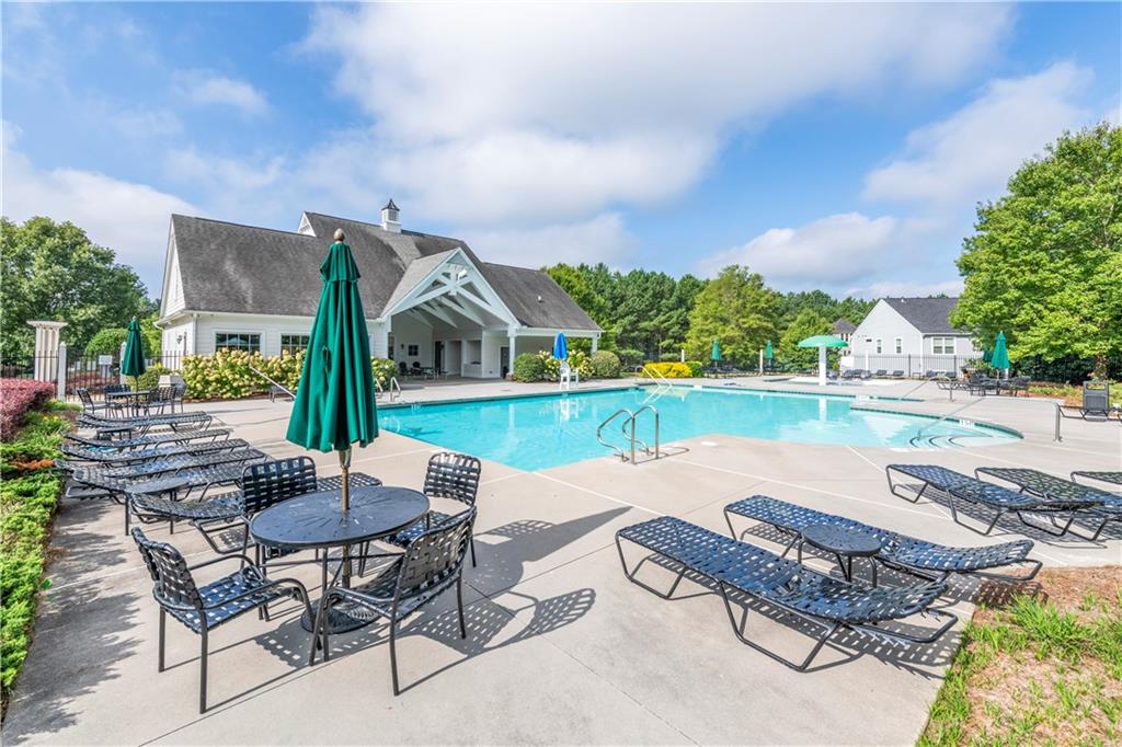 150 Jaime Drive Canton, GA 30114 - Photo 32 of 34 swimming pool with outdoor seating and garden