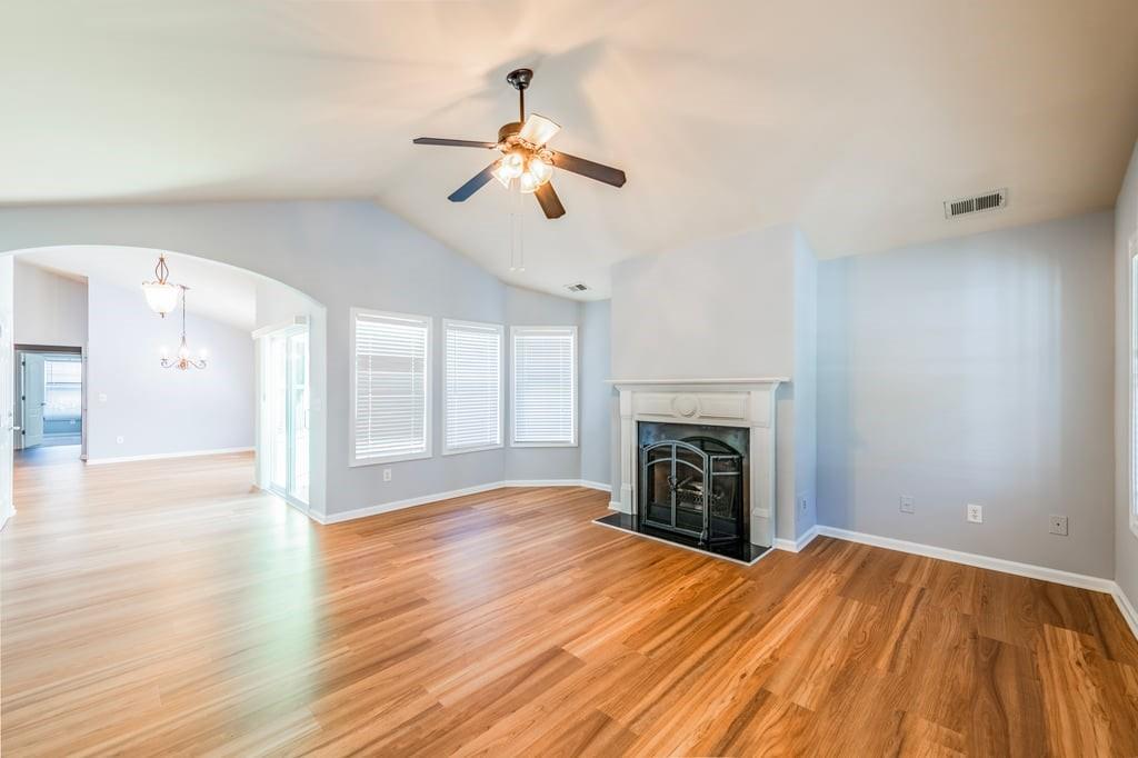 150 Jaime Drive Canton, GA 30114 - Photo 8 of 34 a view of an empty room with wooden floor fireplace and a window
