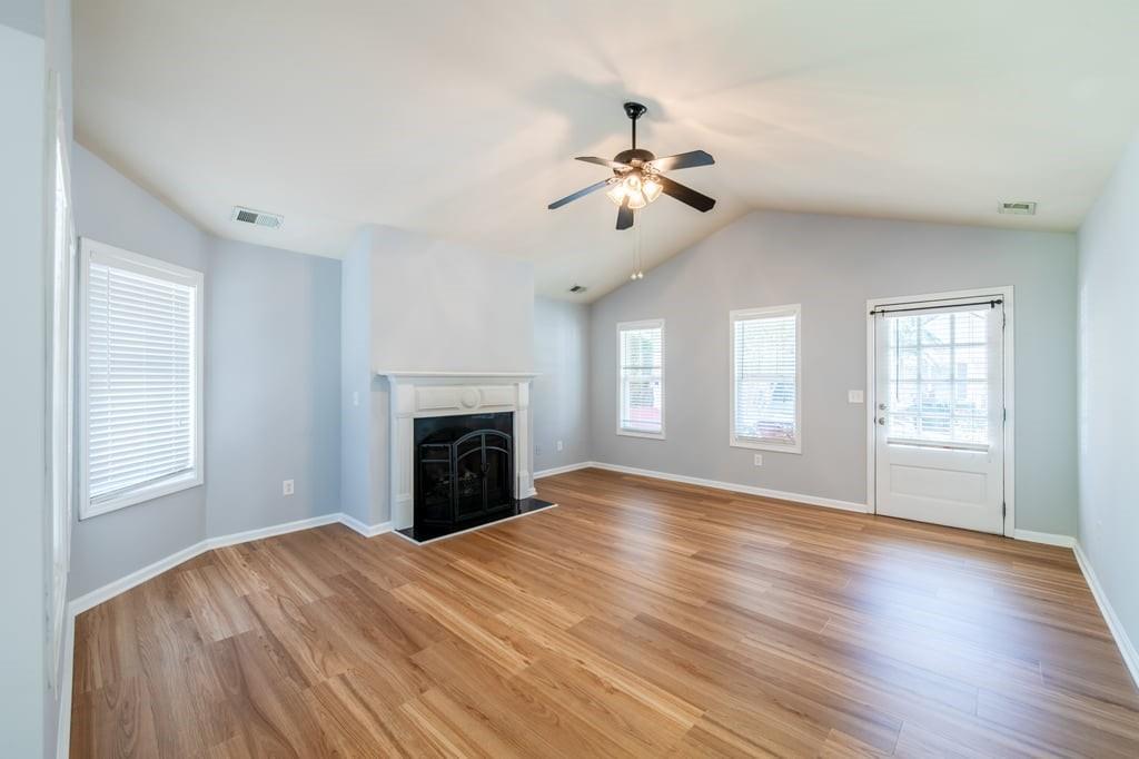 150 Jaime Drive Canton, GA 30114 - Photo 10 of 34 a view of empty room with windows and fireplace