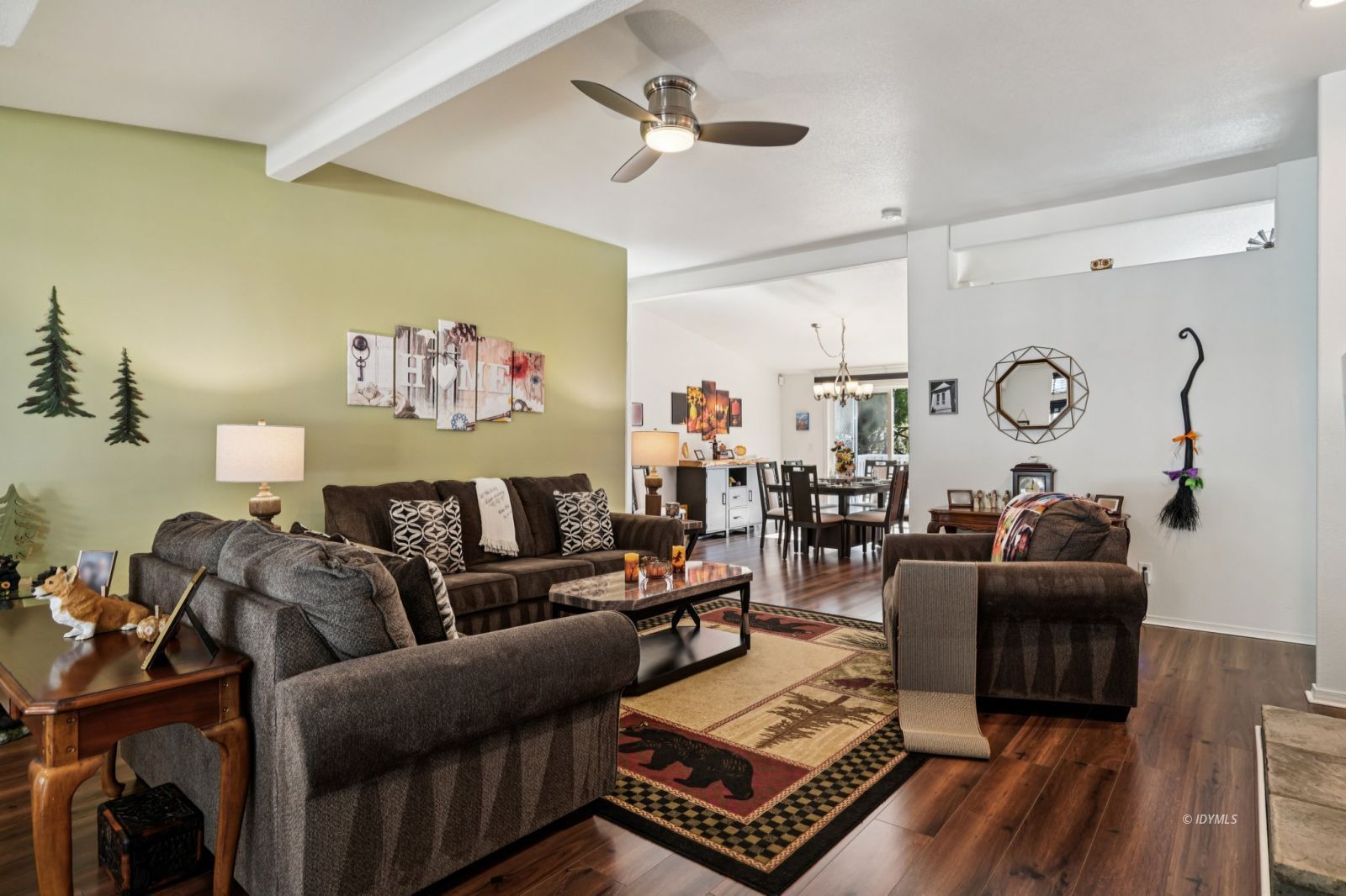 25001 Rim Rock Road Idyllwild, CA 92549 - Photo 5 of 50 a living room with furniture a ceiling fan and a rug