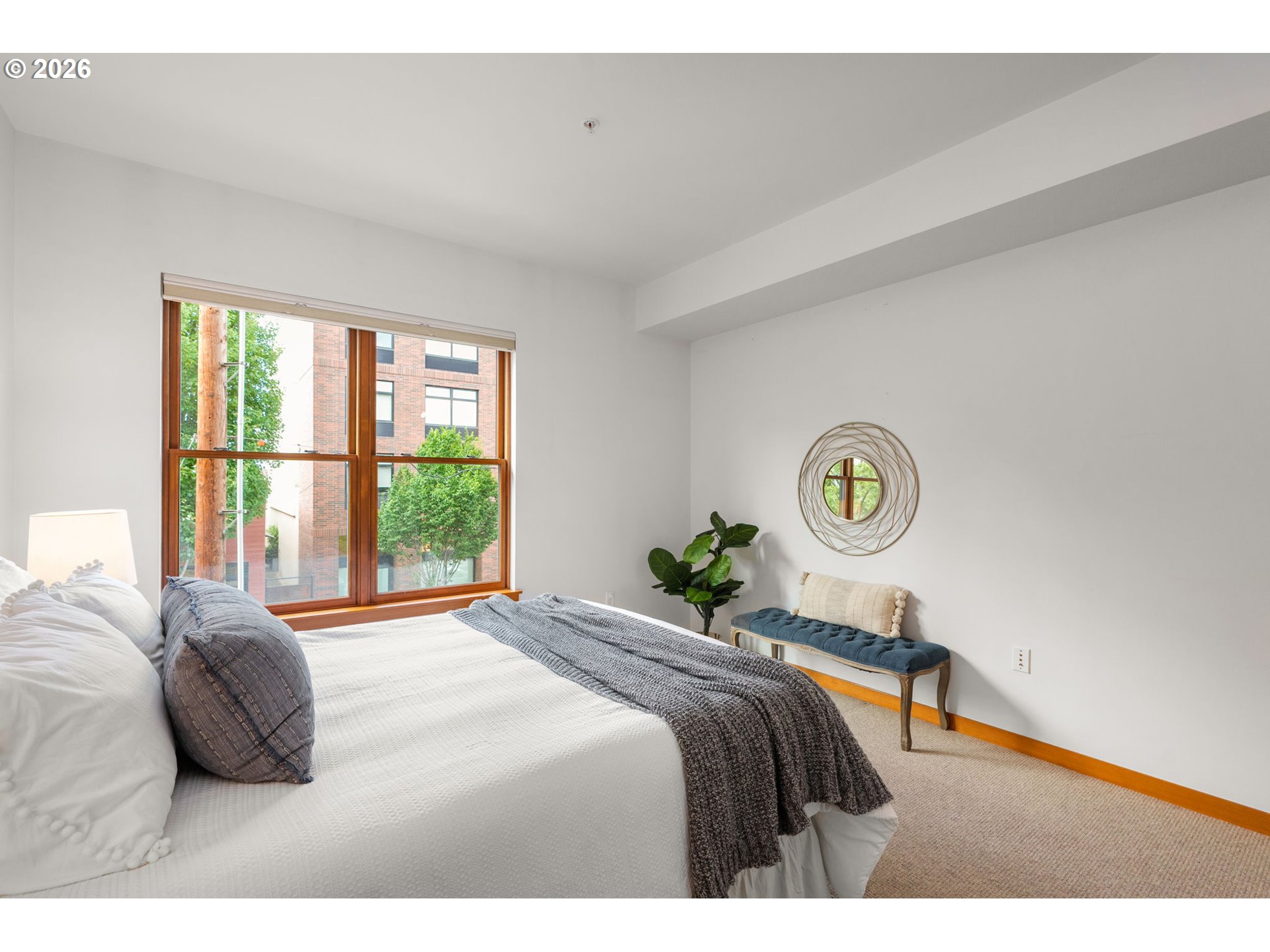 2350 Northwest Savier Street, Unit 224 Portland, OR 97210 - Photo 12 of 19 a bedroom with a bed and window