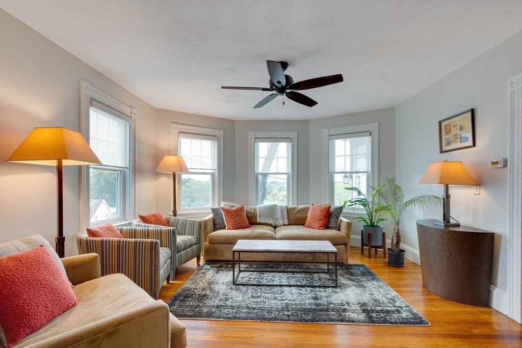a living room with furniture and a rug