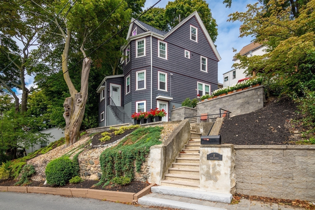 2 Deane Avenue Winthrop, MA 02152 - Photo 3 of 42 a front view of a house with a yard