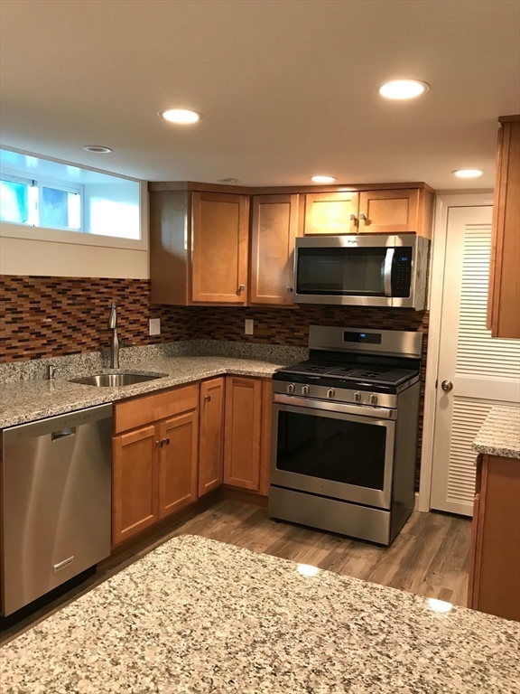 2 Deane Avenue Winthrop, MA 02152 - Photo 40 of 42 a kitchen with a stove and a microwave