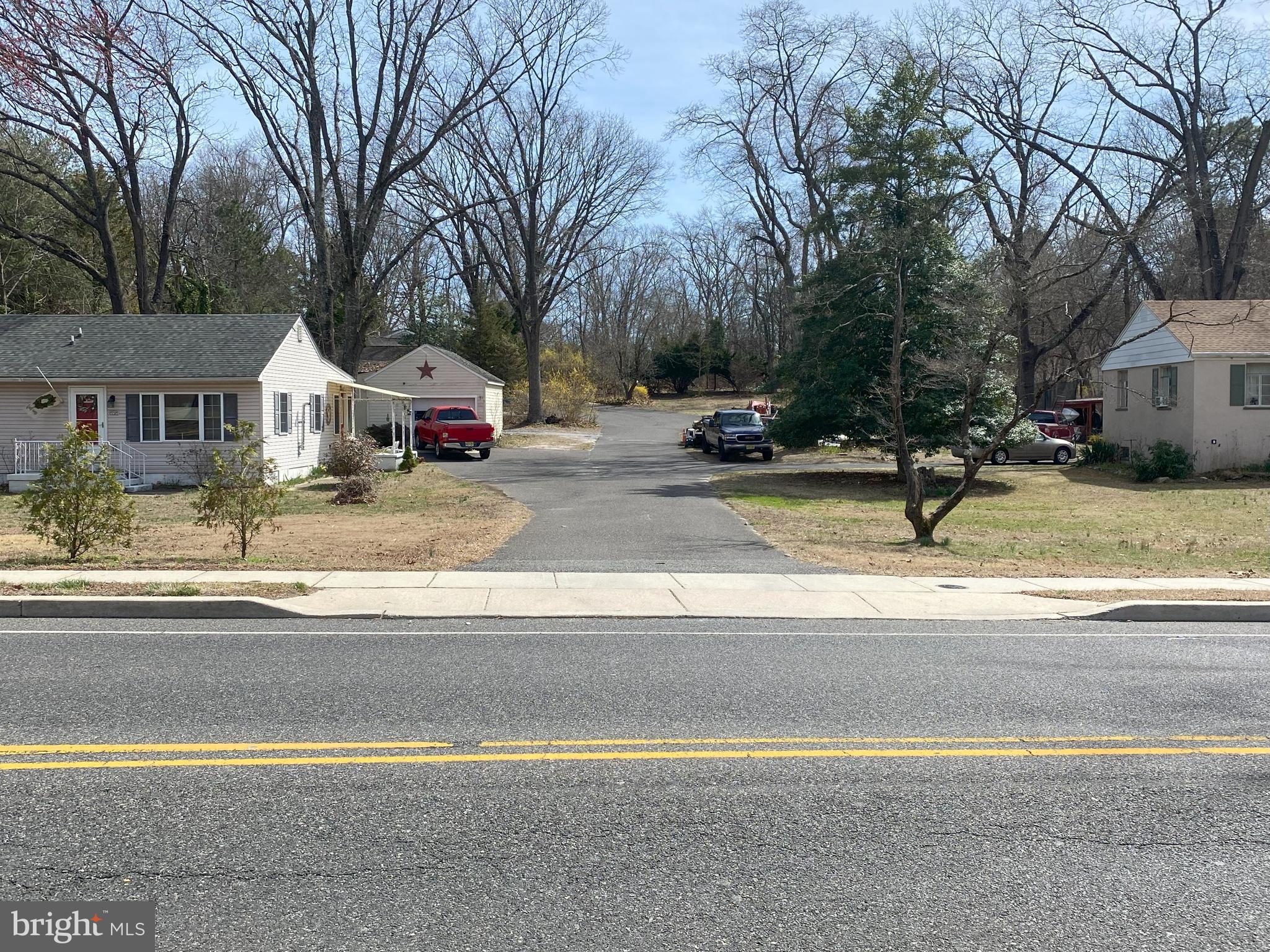 850 Jarvis Road Sicklerville, NJ 08081 - Photo 7 of 9 a front view of a house with a yard and garage