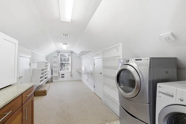 a view of a storage & utility room with washer and dryer