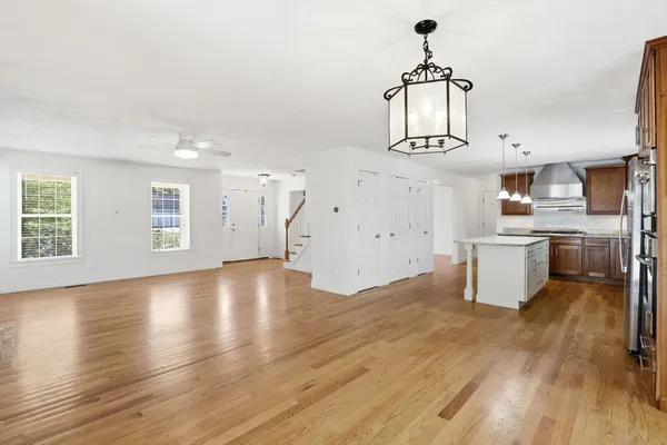 a view of a kitchen with wooden floor