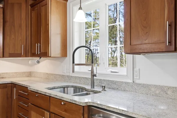 a kitchen with a sink and a window