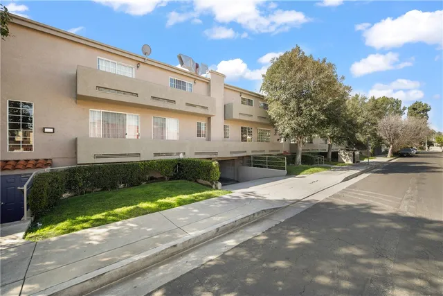 a front view of a house with a yard and a garage