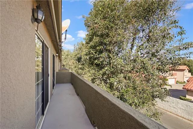 a view of balcony with wooden floor