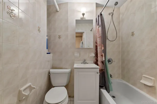 a bedroom with a bed and a chair