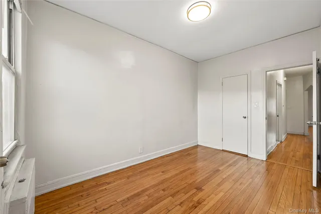 a view of a yard with wooden fence