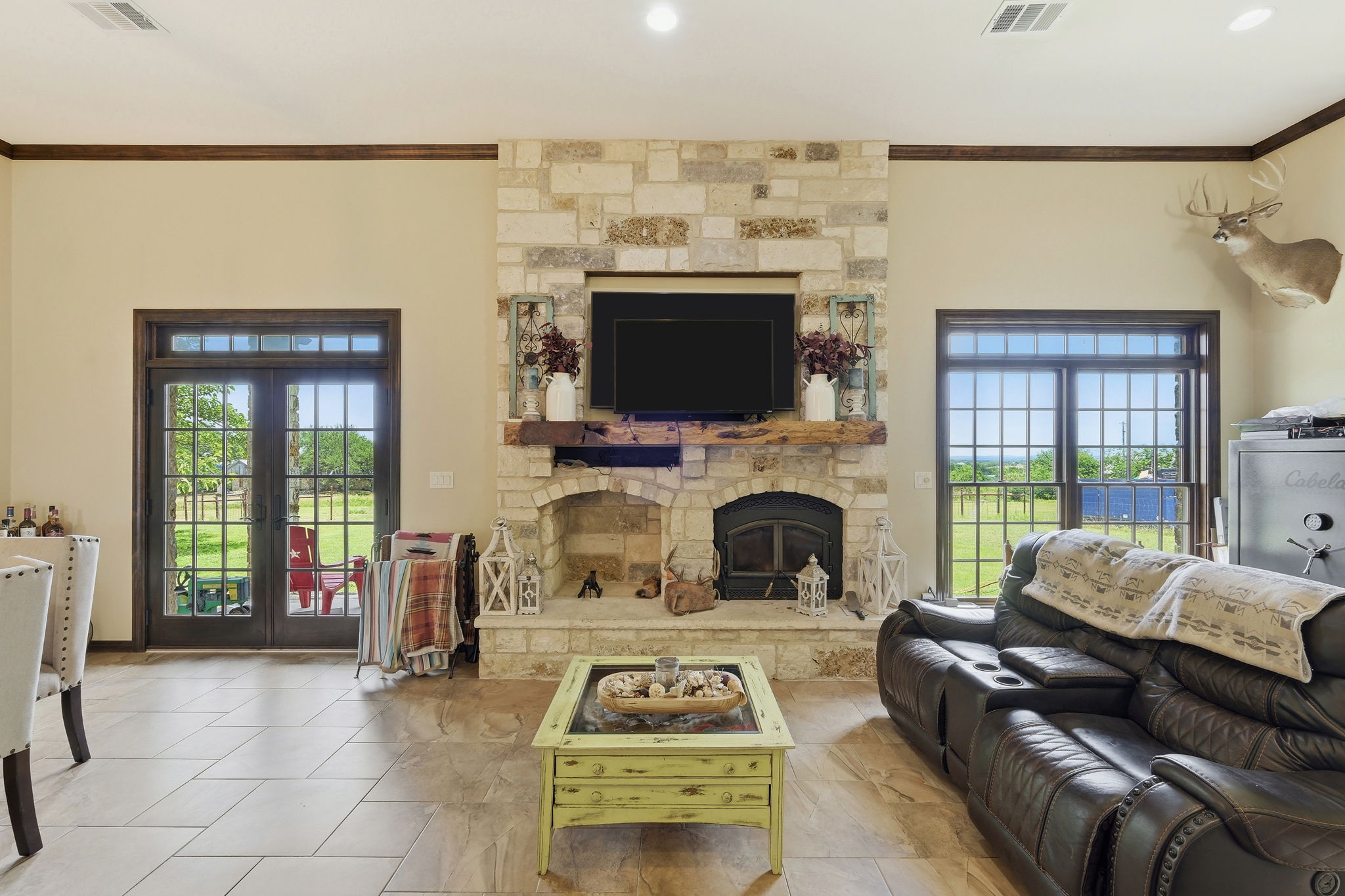 701 County Road 107 Georgetown, TX 78626 - Photo 7 of 30 a living room with furniture a flat screen tv and a fireplace