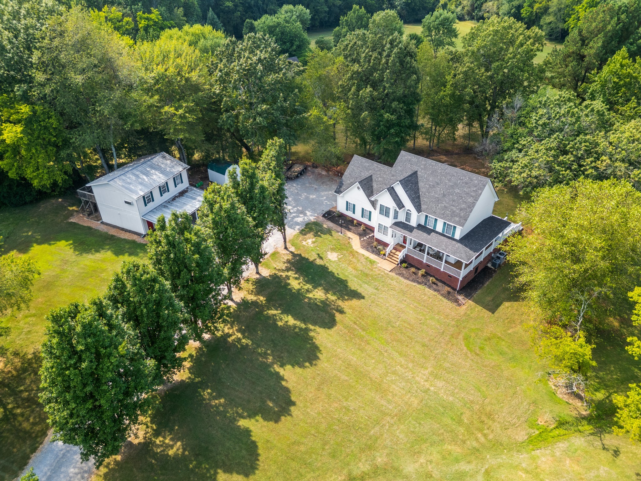 116 Old Parkers Chapel Road Portland, TN 37148 - Photo 12 of 64 an aerial view of a house with swimming pool and garden