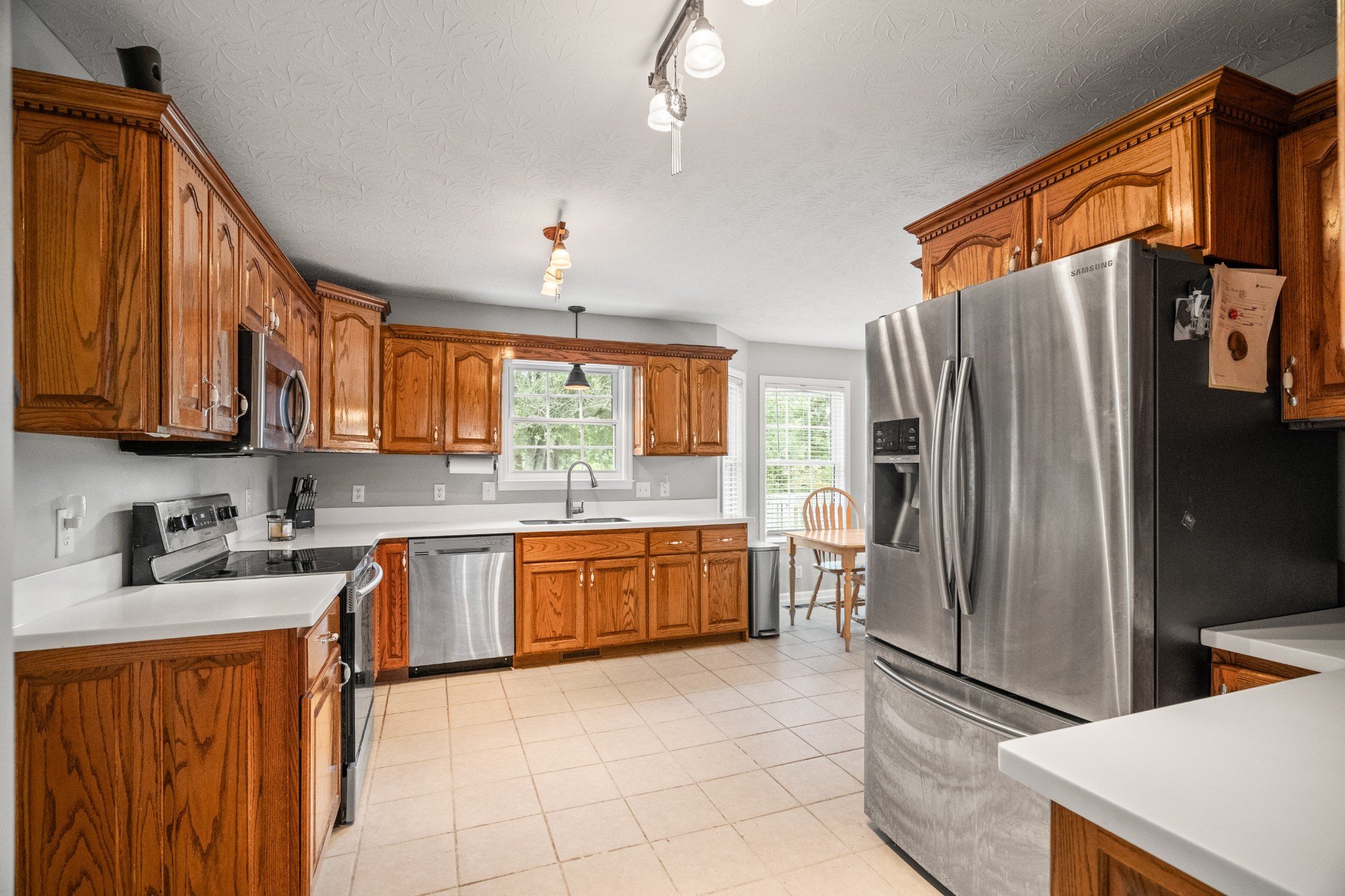 116 Old Parkers Chapel Road Portland, TN 37148 - Photo 27 of 64 a kitchen with stainless steel appliances granite countertop a refrigerator and a sink
