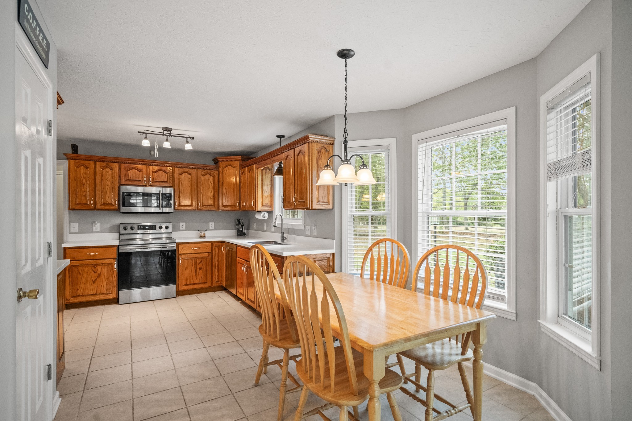 116 Old Parkers Chapel Road Portland, TN 37148 - Photo 33 of 64 a large kitchen with a large window and stainless steel appliances