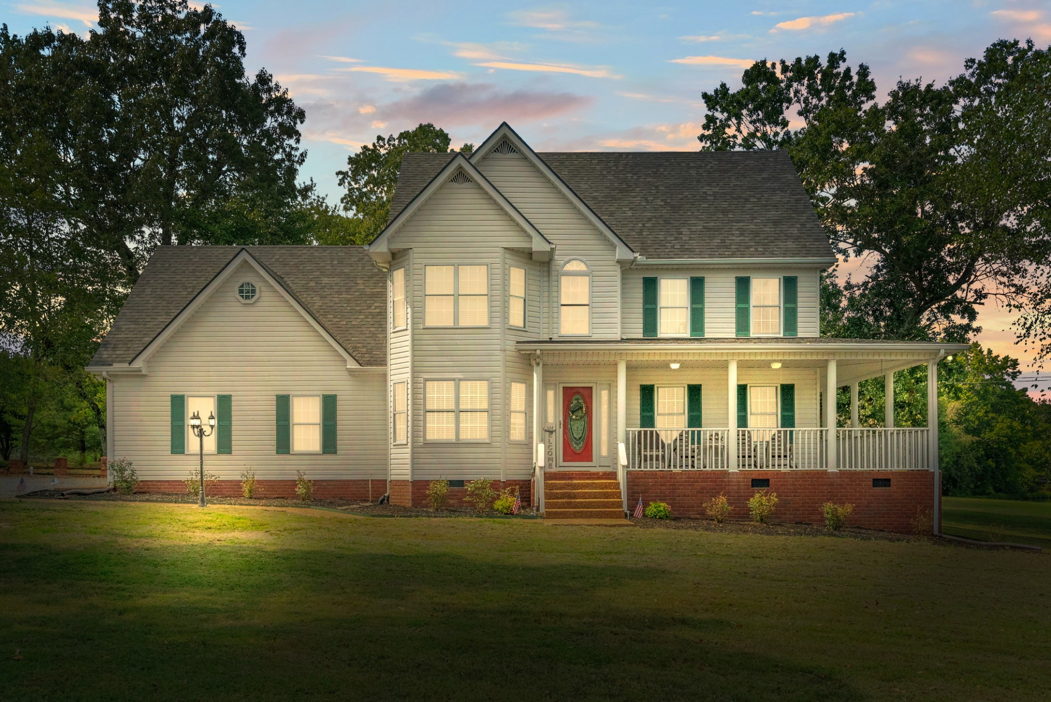 116 Old Parkers Chapel Road Portland, TN 37148 - Photo 4 of 64 a front view of a house with a garden