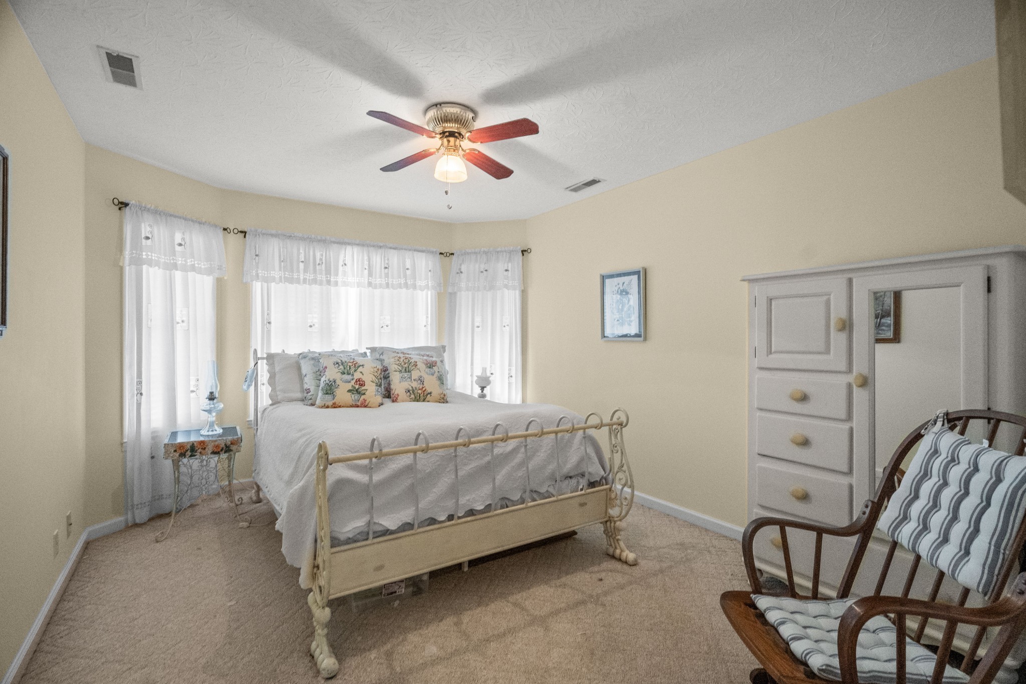 116 Old Parkers Chapel Road Portland, TN 37148 - Photo 45 of 64 a bedroom with a bed and a chandelier