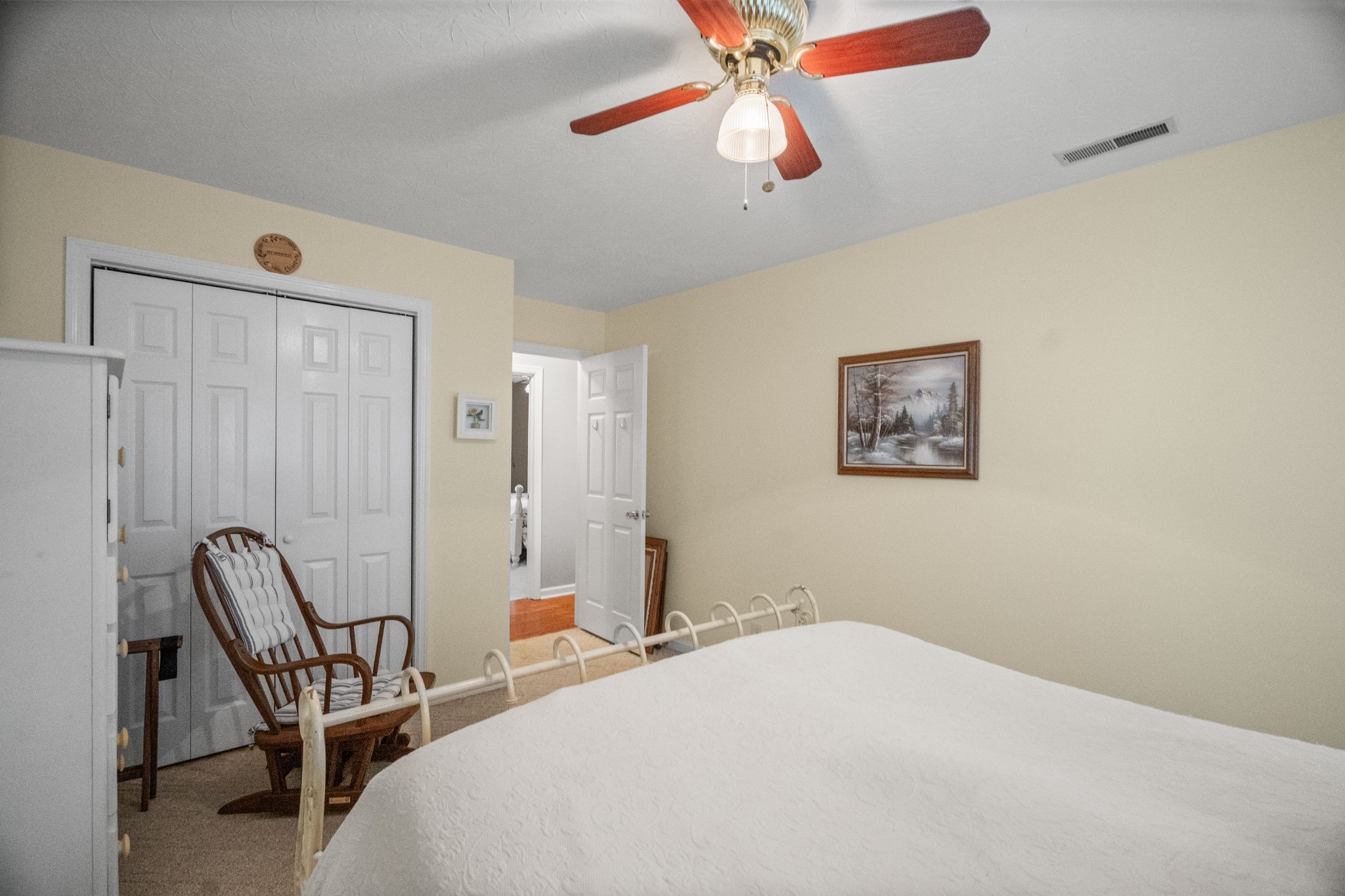 116 Old Parkers Chapel Road Portland, TN 37148 - Photo 46 of 64 a bedroom with a bed and a chandelier