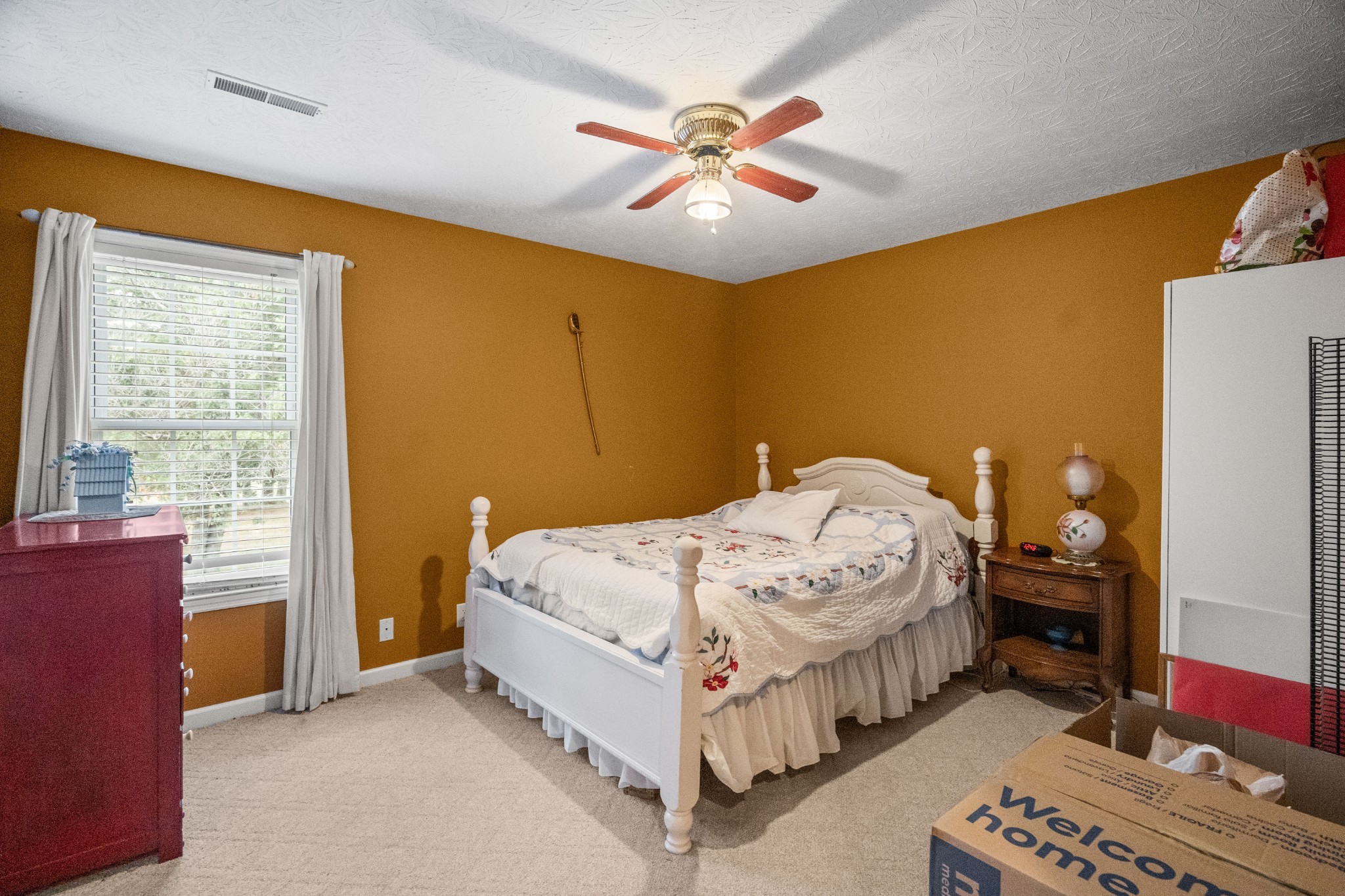 116 Old Parkers Chapel Road Portland, TN 37148 - Photo 48 of 64 a bed room with a bed and a chandelier