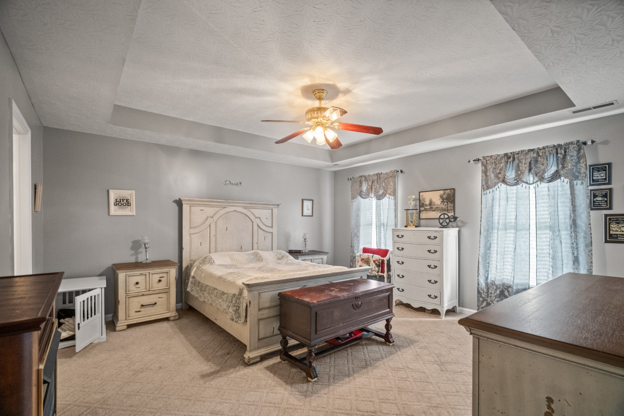 116 Old Parkers Chapel Road Portland, TN 37148 - Photo 50 of 64 a bedroom with a bed and a chandelier