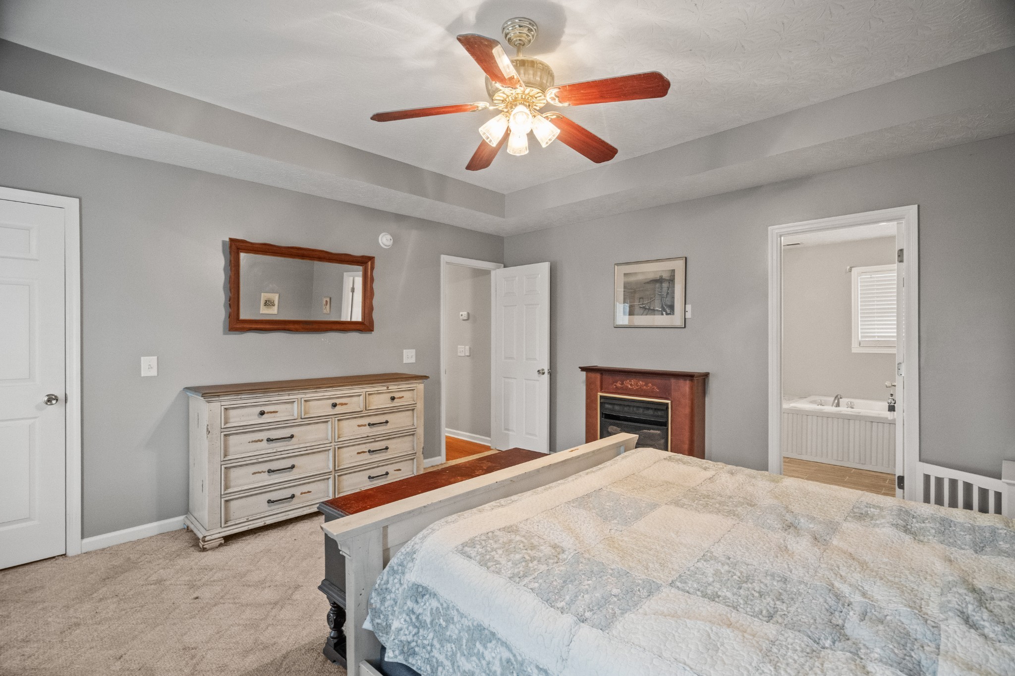 116 Old Parkers Chapel Road Portland, TN 37148 - Photo 51 of 64 a bedroom with a bed and a chandelier