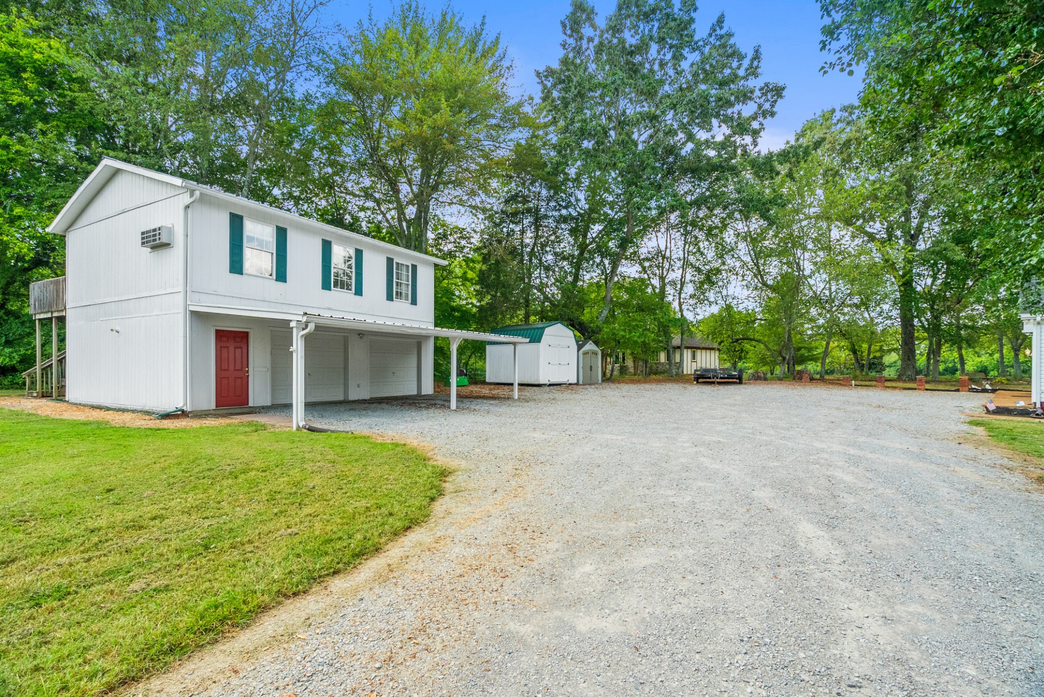 116 Old Parkers Chapel Road Portland, TN 37148 - Photo 61 of 64 a view of an house with backyard and a tree