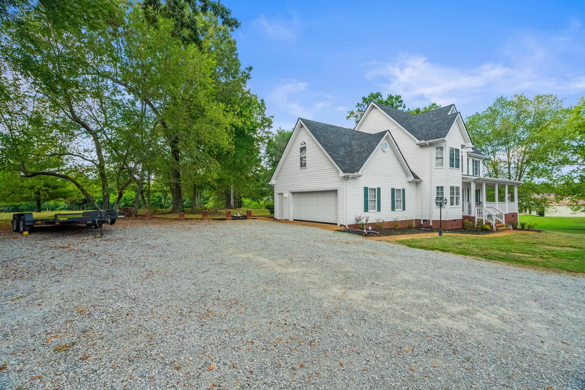 116 Old Parkers Chapel Road Portland, TN 37148 - Photo 8 of 64 a view of a house with a yard and large trees