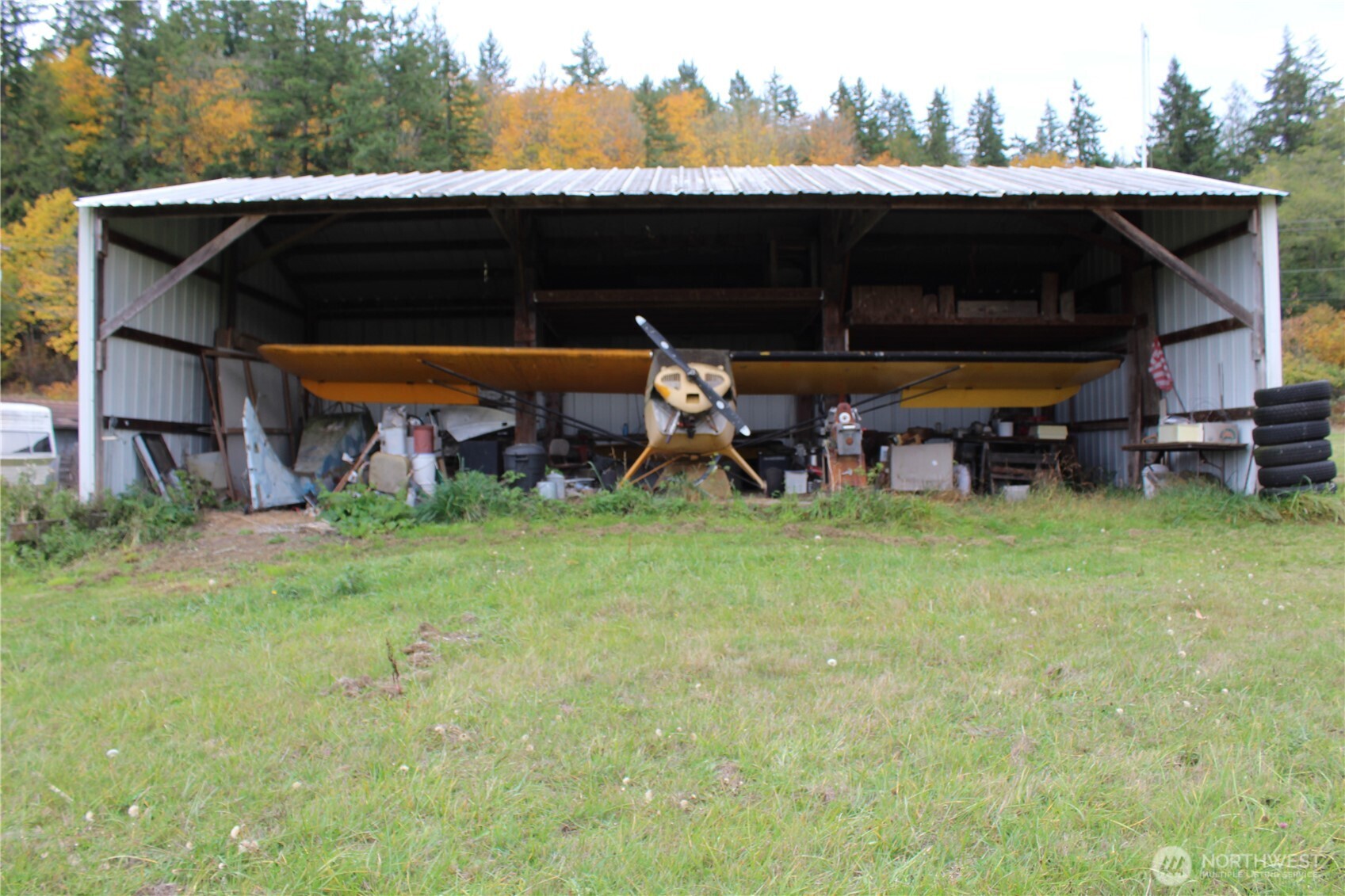 2600 Center Road Chimacum, WA 98325 - Photo 17 of 22 a view of a chairs and table in the back yard of the house