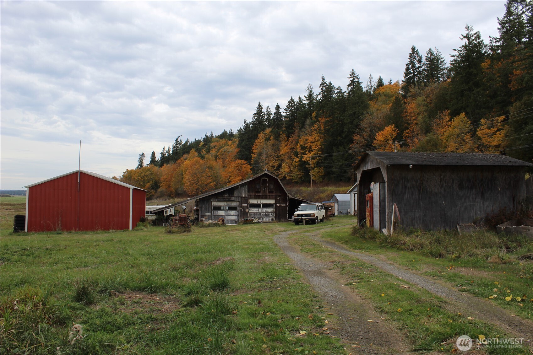 2600 Center Road Chimacum, WA 98325 - Photo 19 of 22 a view of a house with a yard and sitting area