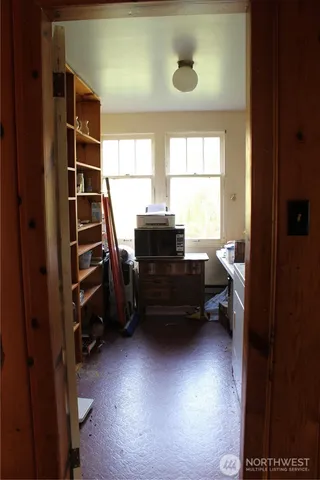 a kitchen with a cabinets and a stove top oven
