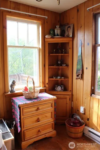 a view of a room with a window and a chandelier