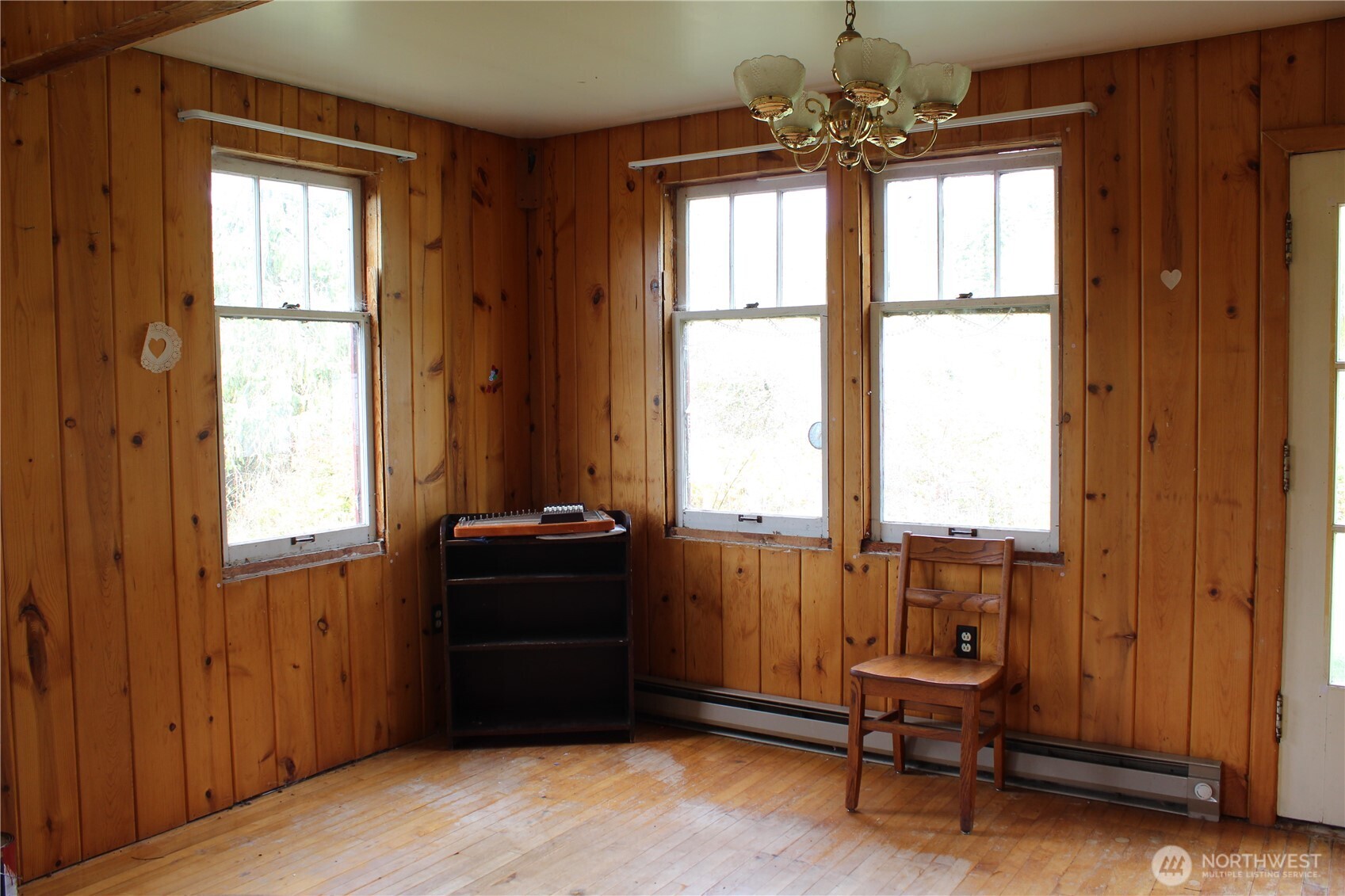 2600 Center Road Chimacum, WA 98325 - Photo 9 of 22 a view of a room with a window and a chandelier