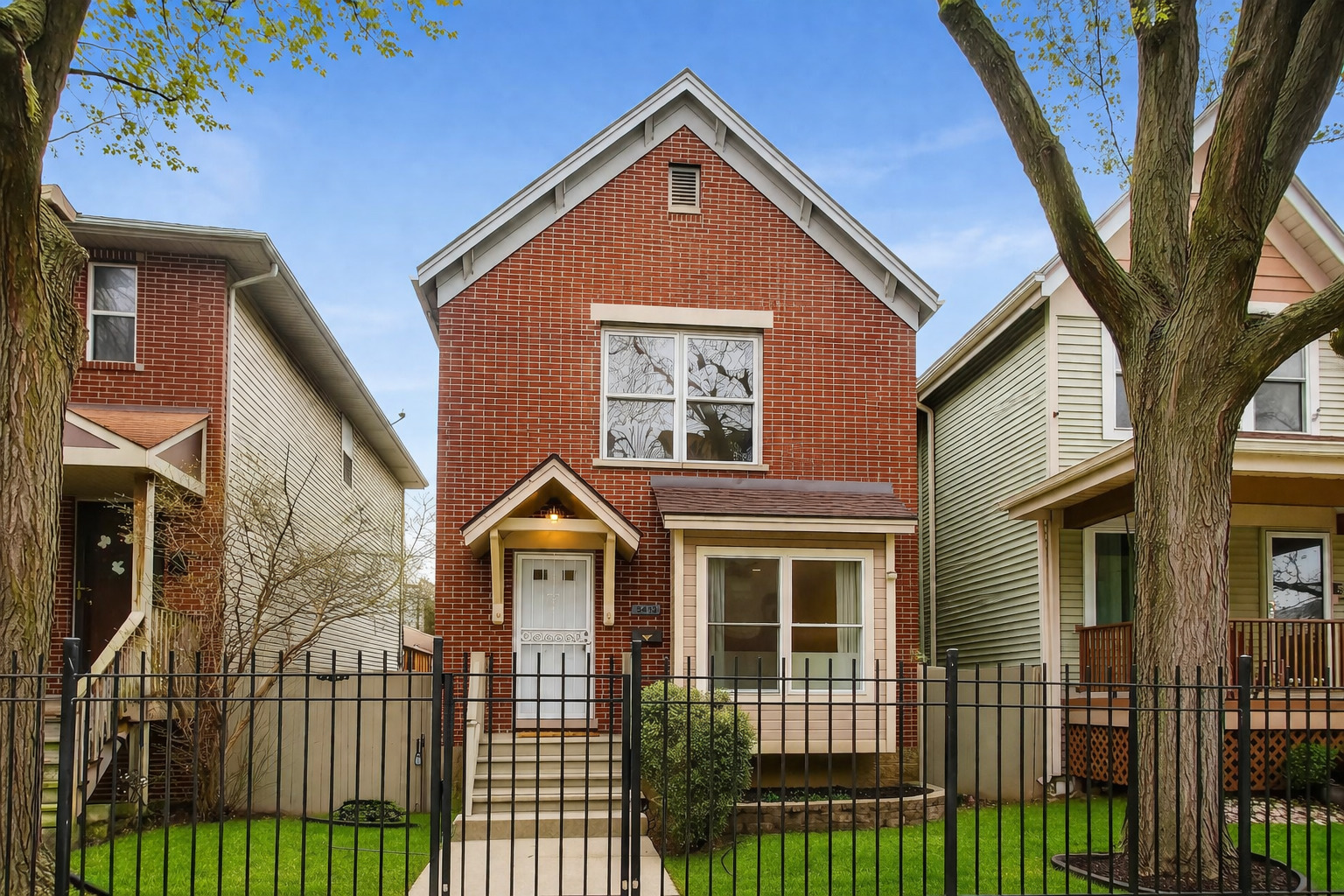3413 South Indiana Avenue Chicago, IL 60616 - Photo 1 of 15 a front view of a house with glass windows