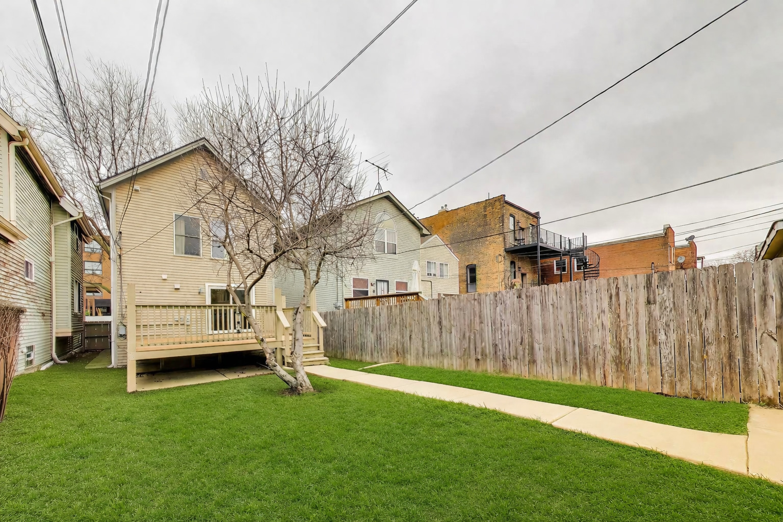 3413 South Indiana Avenue Chicago, IL 60616 - Photo 15 of 15 a view of a backyard with wooden fence