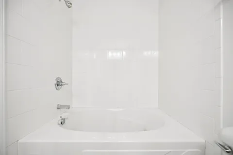 a close up of a bathtub in a bathroom