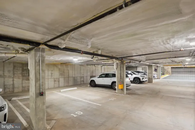 a view of parking garage with cars