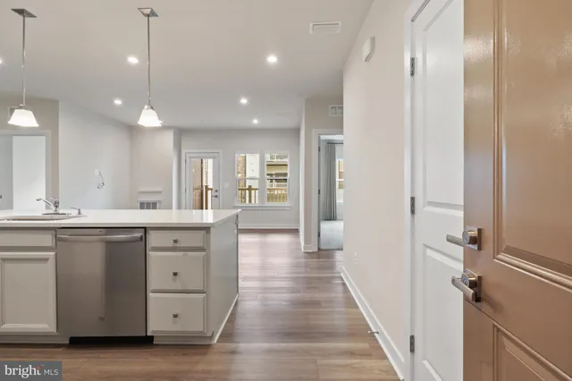 a bathroom with a sink a mirror and a shower